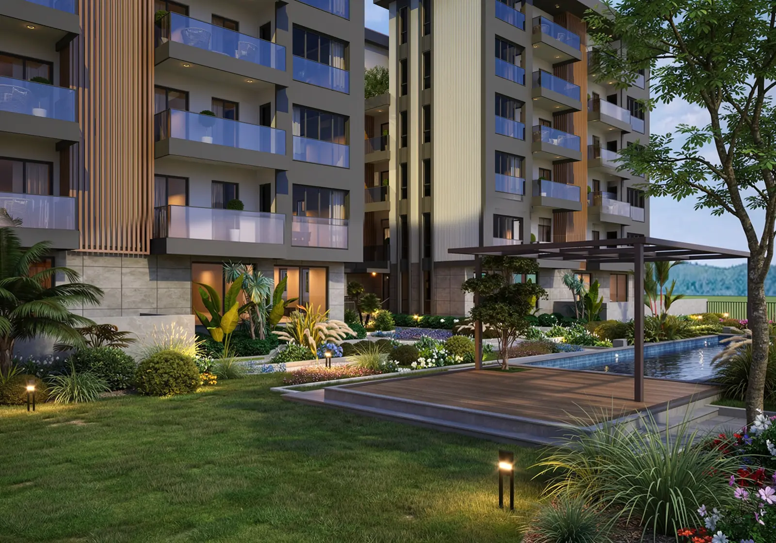 Akşam ışığında site bahçesi, ahşap deck, pergola ve havuz